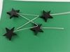 4 stk. Sorte  træ stjerner på blød formbar tråd. Stjernerne måler ca. ø 4 cm.